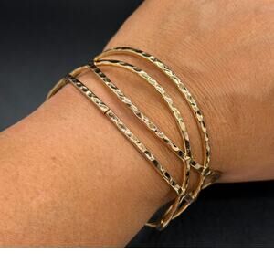 Beautiful Gold Tone crossed cuff Bracelet